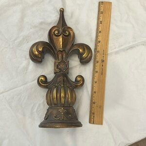 Wood fleur-de-lis.